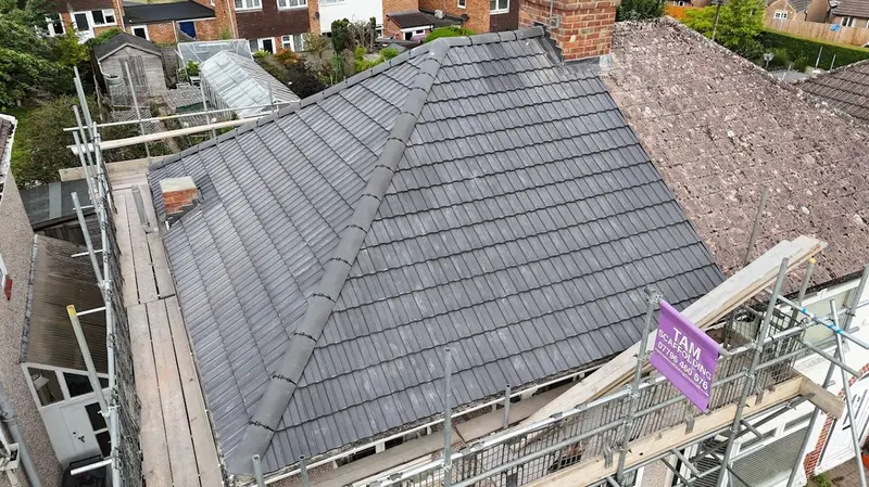 New grey concrete tile hipped roof on a bungalow in Swindon by JK Roofing